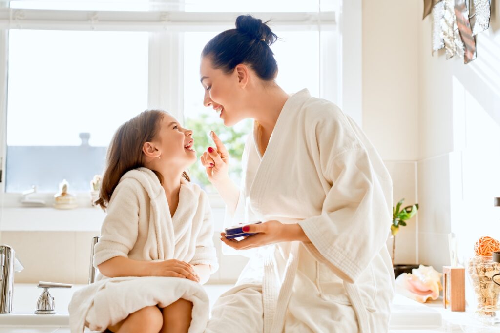 mother and daughter in robes